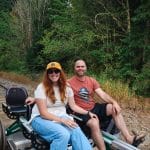 Man and woman sitting on a Railcycle at Railcycle Mt. Rainier